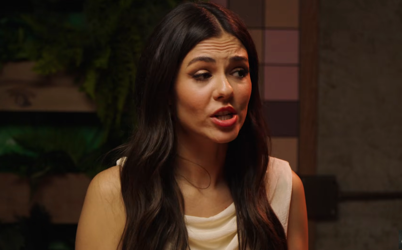 Victoria Justice talking animatedly during an interview