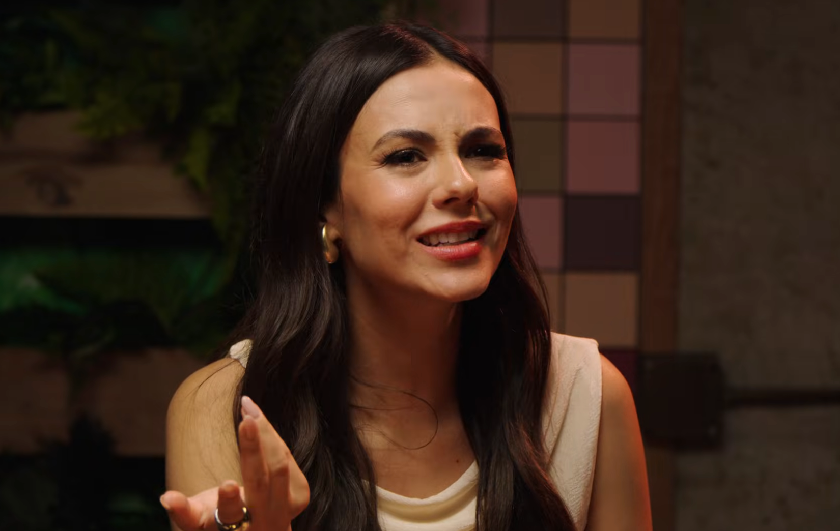 Victoria Justice gesturing while speaking during an interview