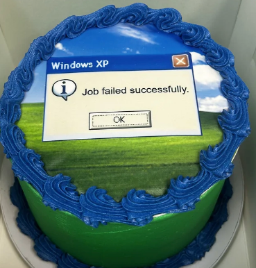 Cake decorated with a Windows XP error message reading, "Job failed successfully."