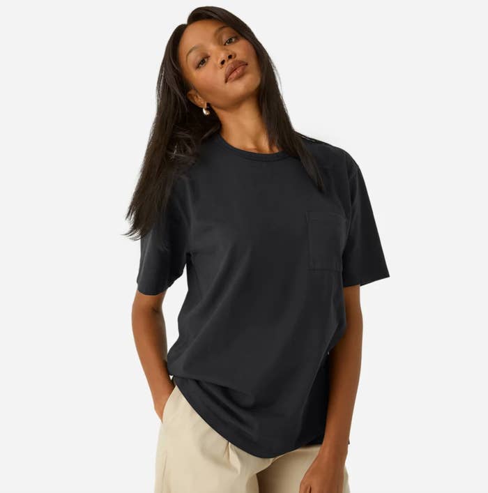 Model wearing a achromatic premium value fellow tee