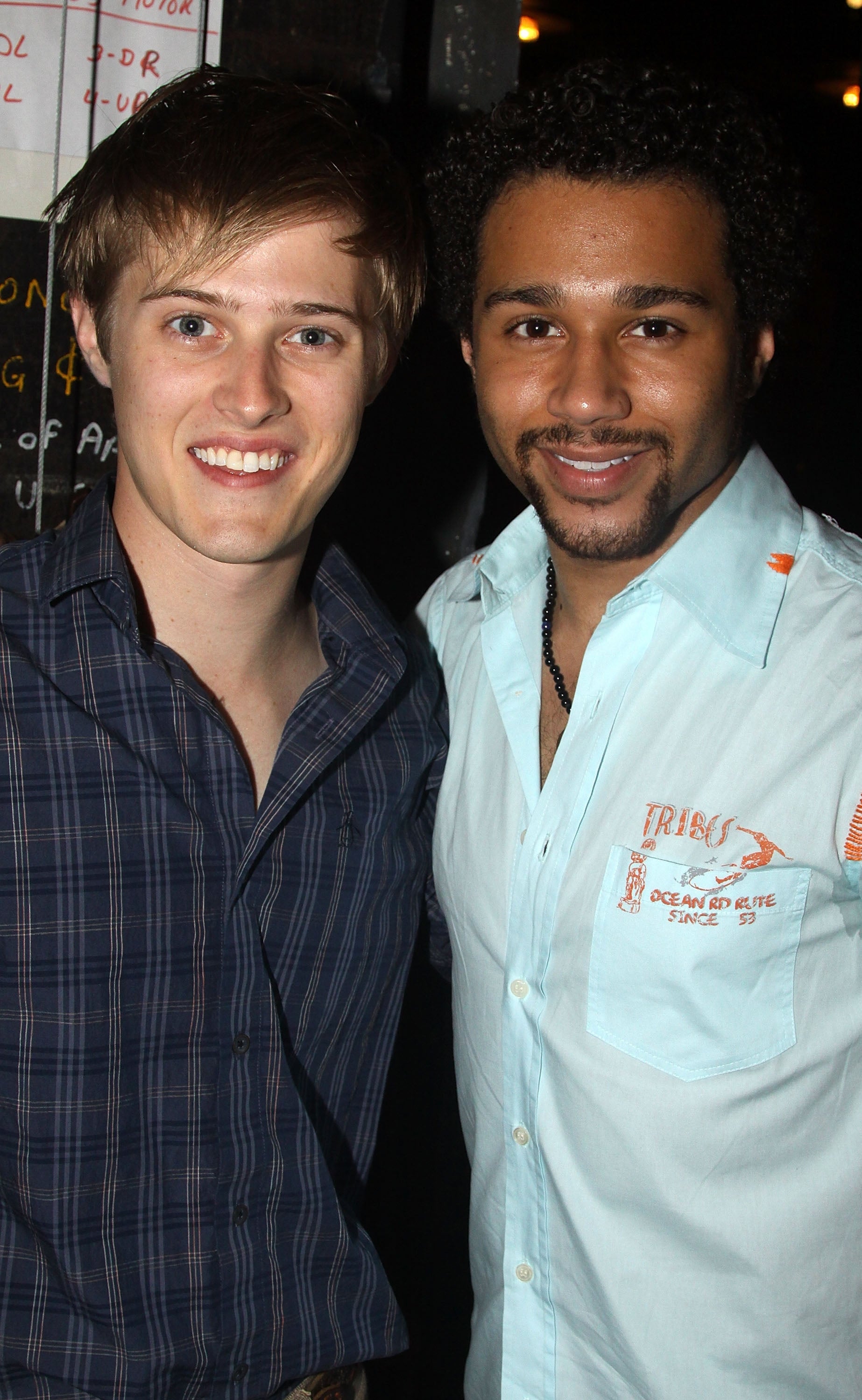 Lucas Grabeel and Corbin Bleu posing for a photo at an event