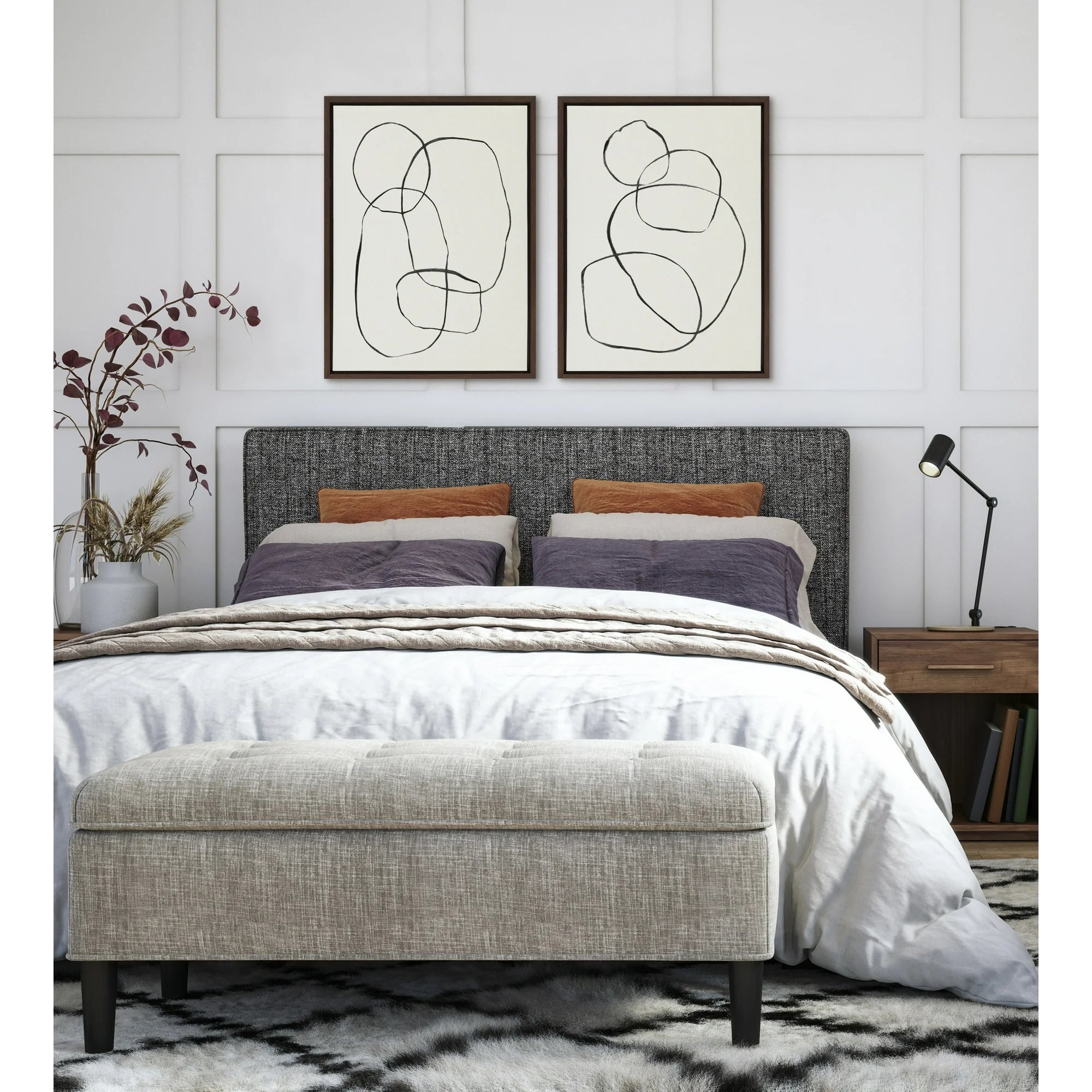 Bedroom with a modern, upholstered bed, abstract creation  connected  the wall, and a cozy seat  astatine  the foot. Nightstands with lamps flank the bed