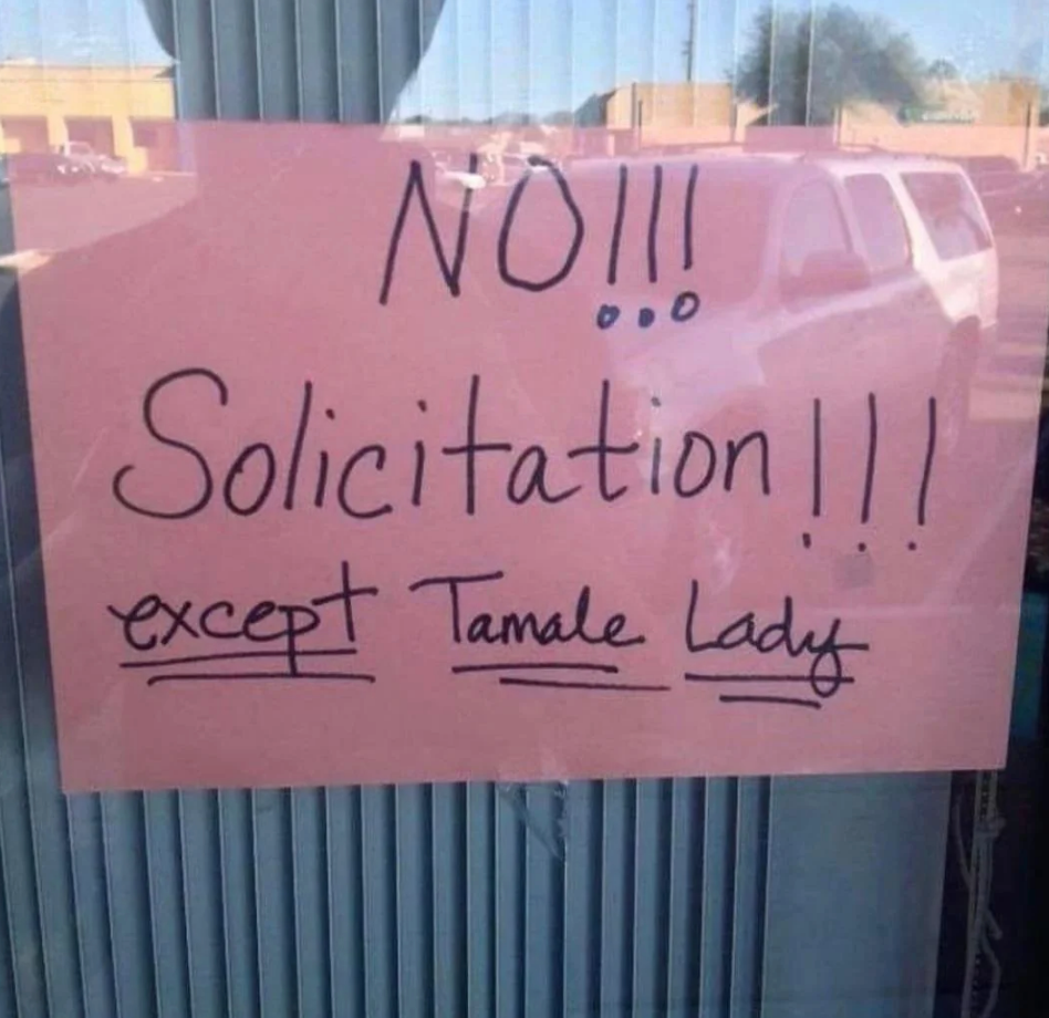Sign on a window reads, "No Solicitation!!! except Tamale Lady," allowing a specific vendor to solicit