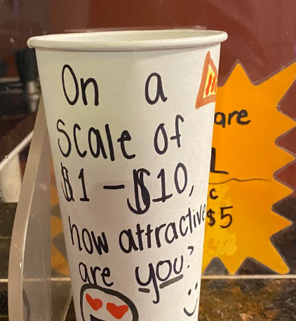 Tip cup with handwritten text asking how attractive the person is on a scale of $1 to $10, with smiley and heart faces drawn on it