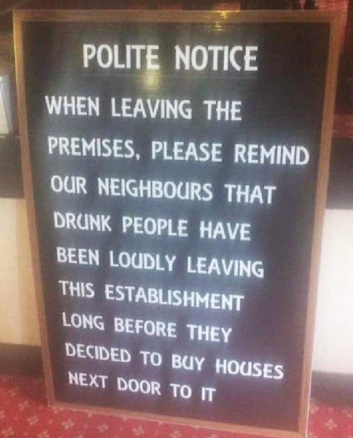Sign humorously asks patrons to remind neighbors that drunk patrons have been leaving loudly since before nearby houses were built