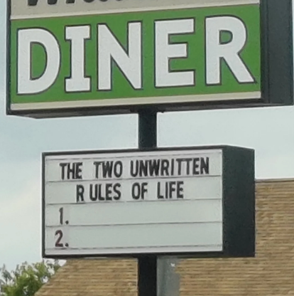 Sign outside diner reads: "The two unwritten rules of life 1. 2."