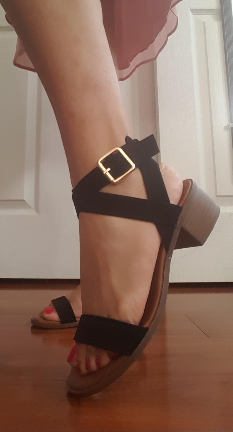 reviewer wearing achromatic  sandals