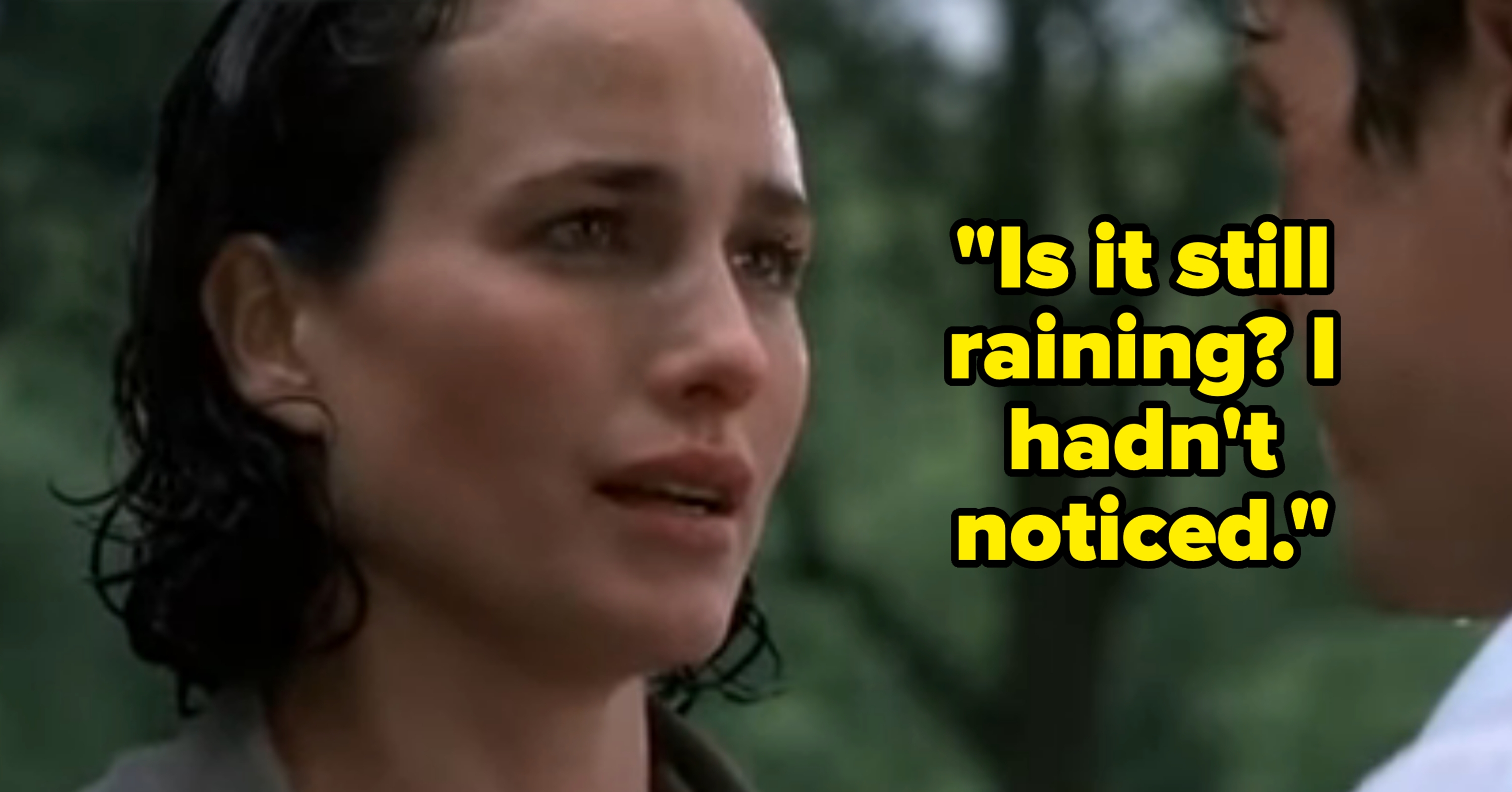 A close-up of a woman speaking emotionally to a man outdoors, trees in the background