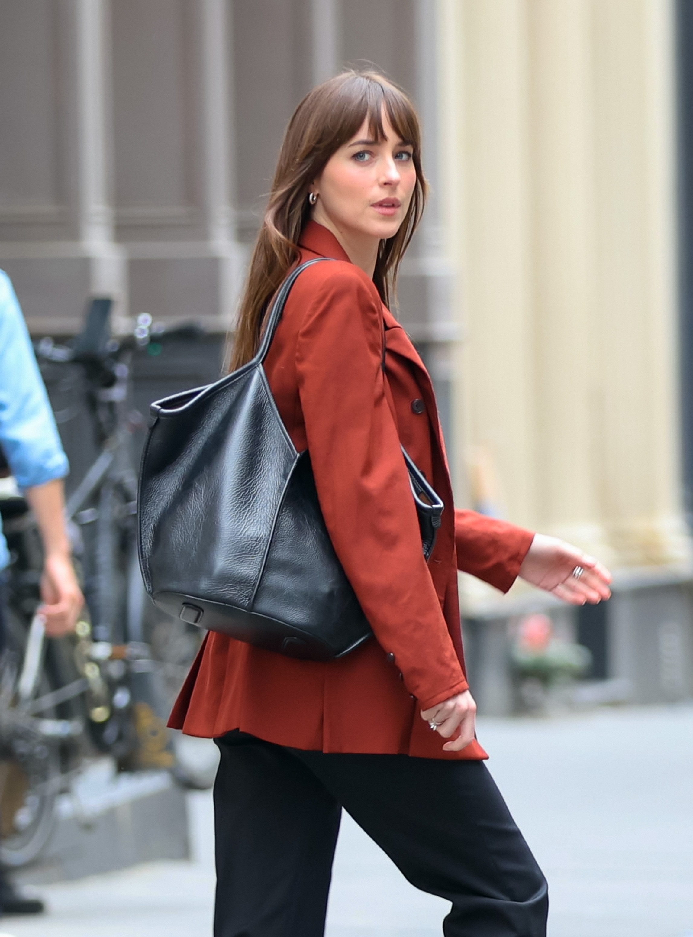 Dakota Johnson walking on a city street