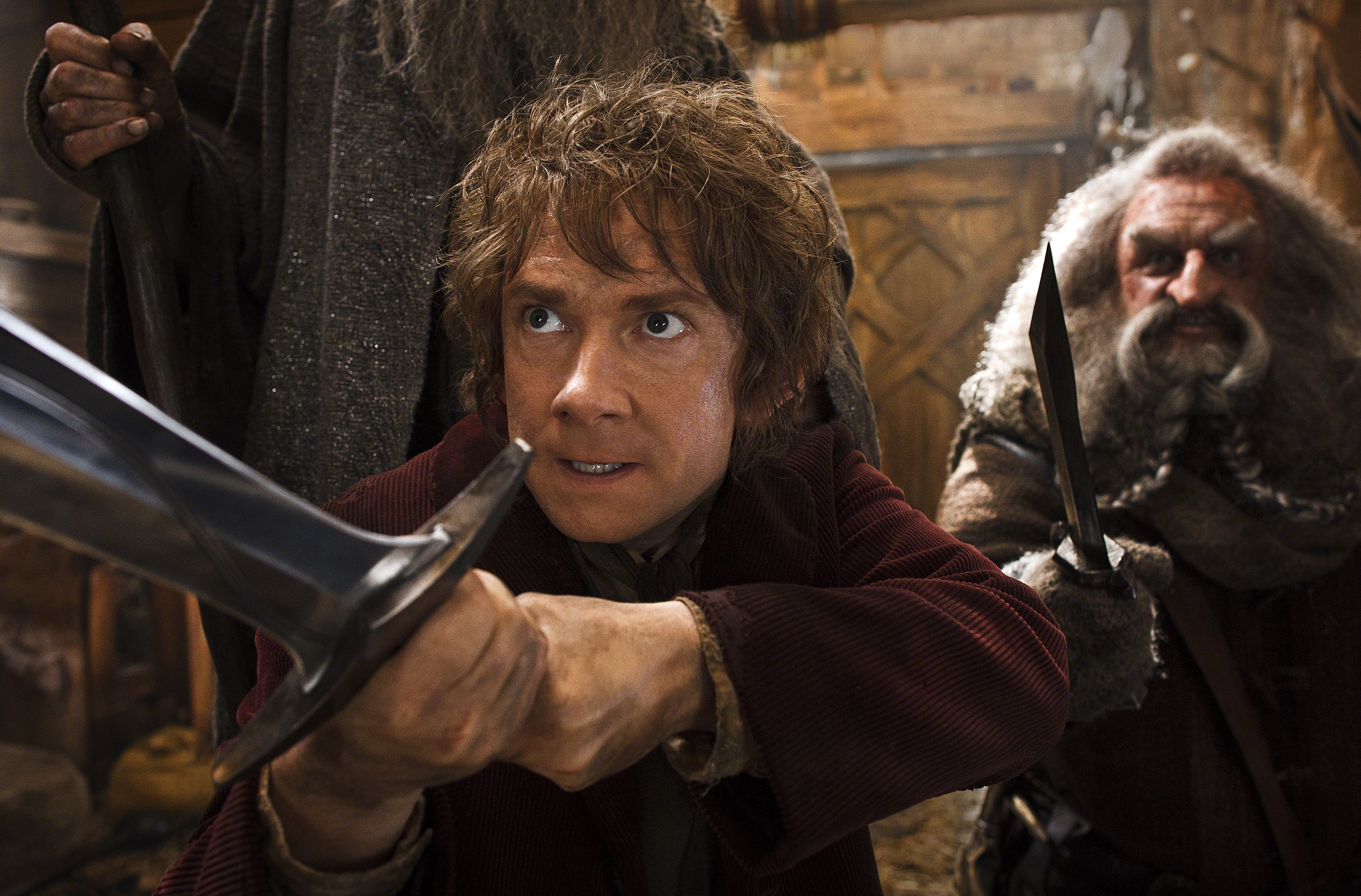 Bilbo holding a sword in a defensive pose