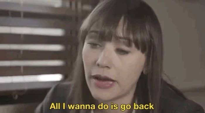 A woman with bangs expresses a longing to return to the past, saying, "All I wanna do is go back."