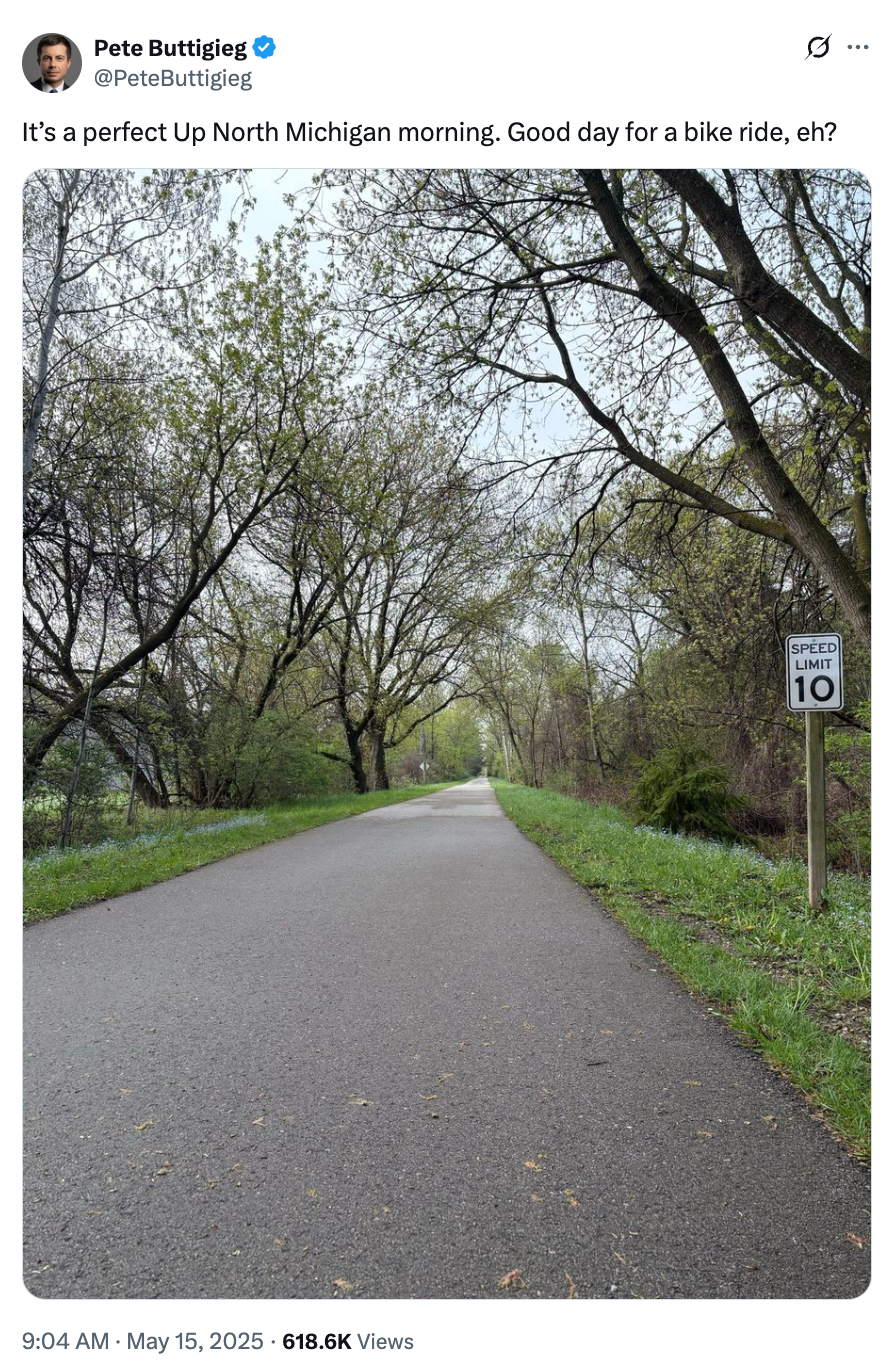 Pathway through trees with a 10 mph speed limit sign. Tweet mentions a morning in Michigan being ideal for a bike ride