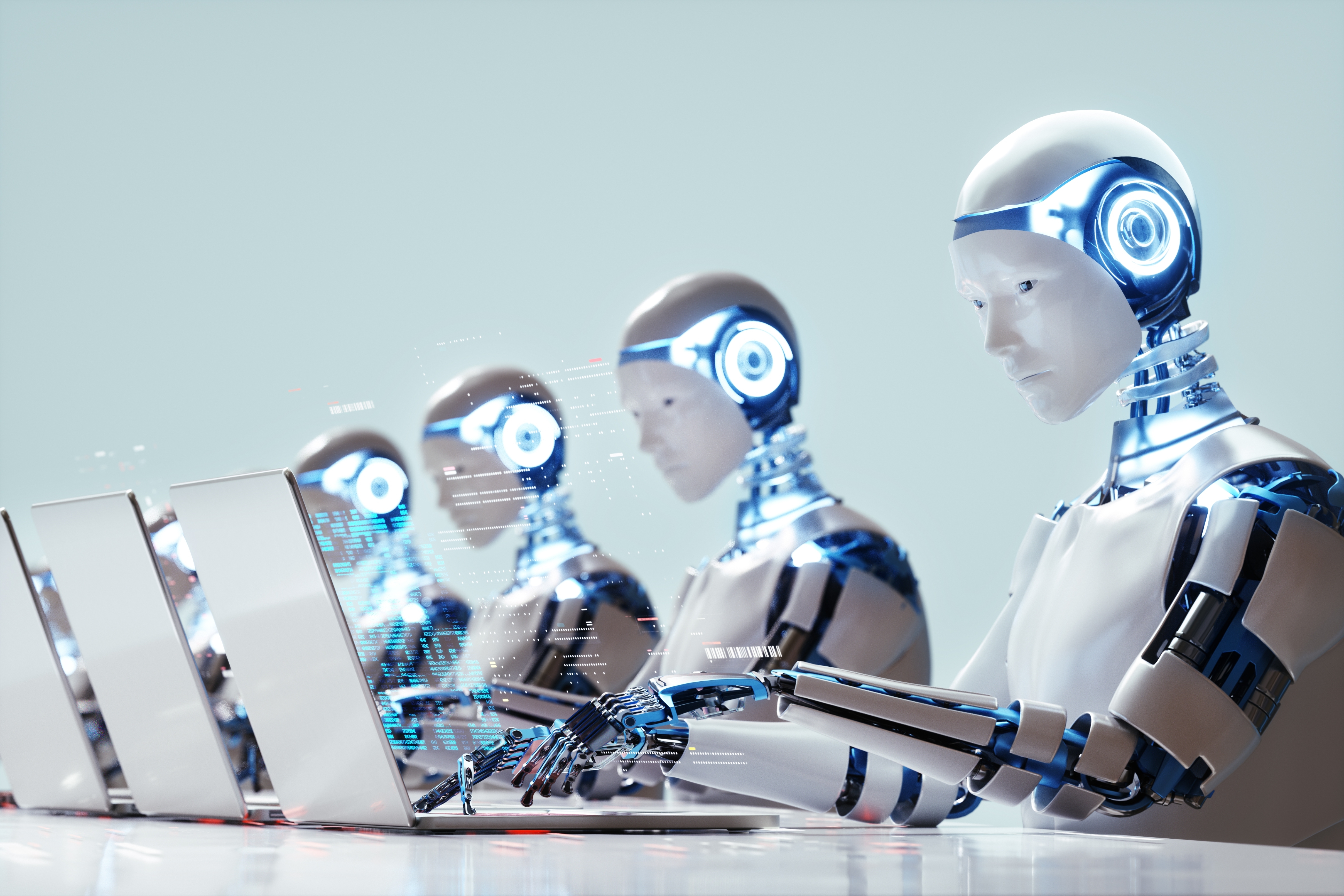 Robots with human-like features sit in a row, typing on laptops, symbolizing advanced AI technology and automation in various industries