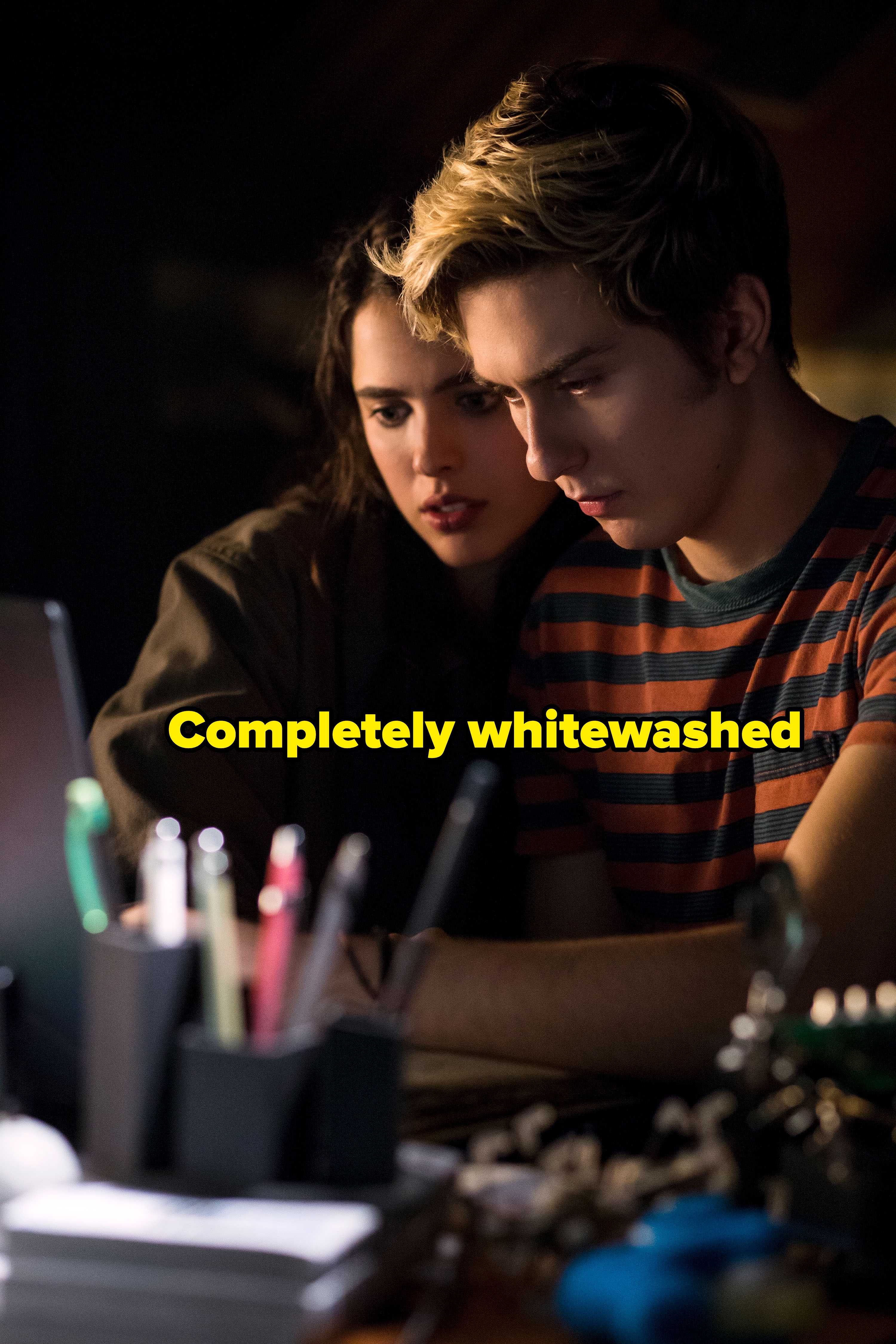 Light and Mia look at a computer screen, captioned "completely whitewashed"