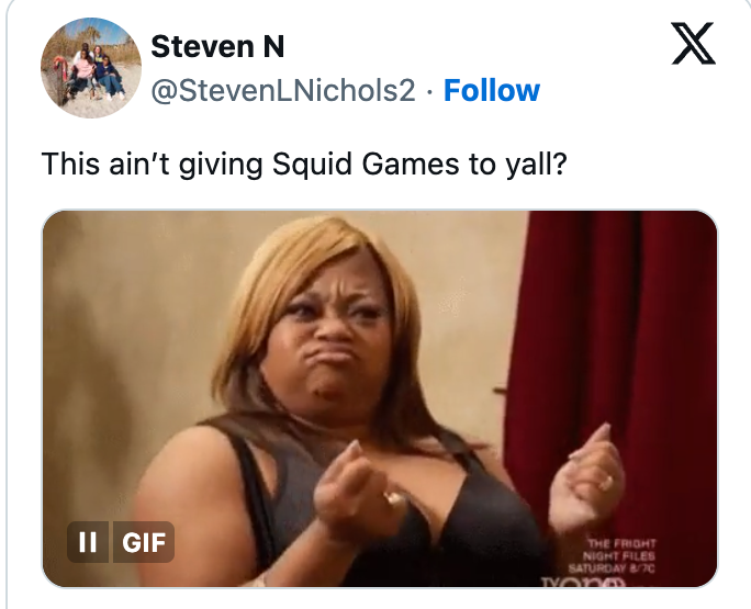 Person mimicking a scene, gesturing with their hands. Visible text: &quot;This ain't giving Squid Games to yall?&quot;