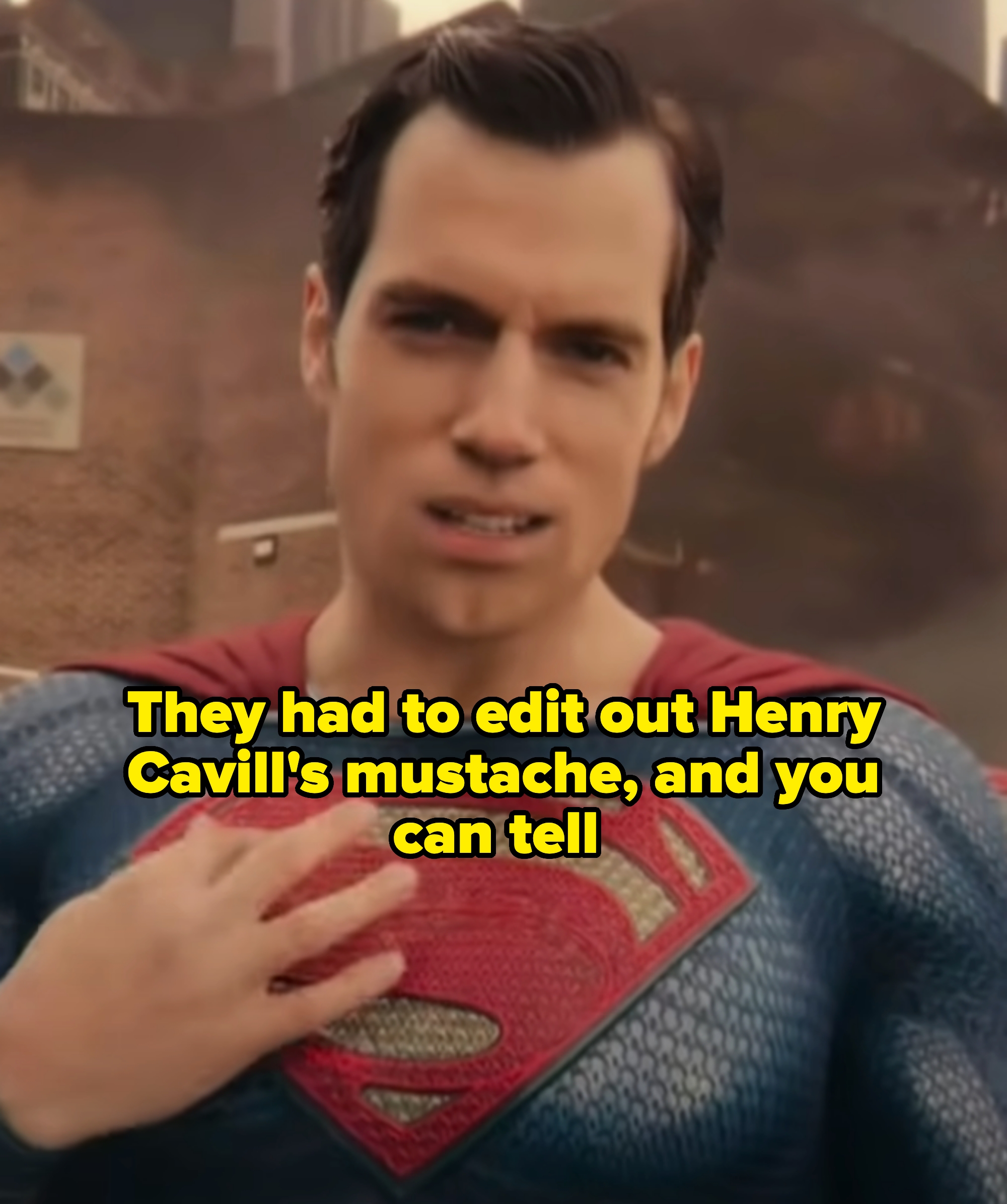 Henry Cavill as Superman with an odd-looking mouth captioned "they had to edit out Henry Cavill's mustache, and you can tell"