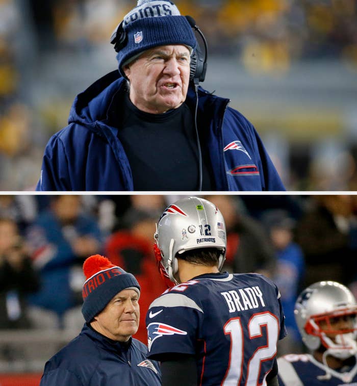 A coach on the sideline during a football game, wearing a headset, team cap, and heavy jacket