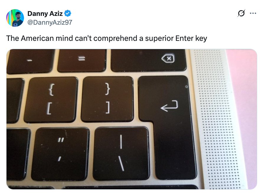 A keyboard with large Enter and shift keys is shown in close-up alongside a tweet poking fun at American keyboard layouts