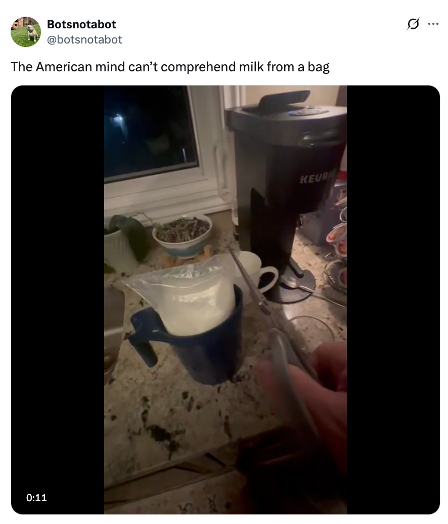 Person pours milk from a bag into a mug. Tweet text above reads: "The American mind can’t comprehend milk from a bag."