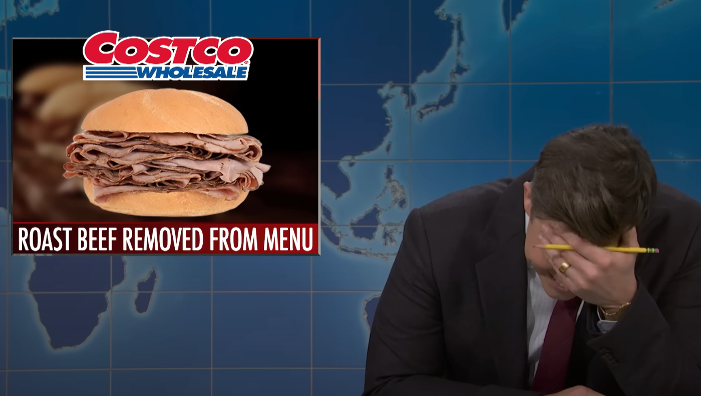 TV host laughing with head in hand; screen shows "Costco Wholesale" and "Roast Beef Removed from Menu" with a sandwich image