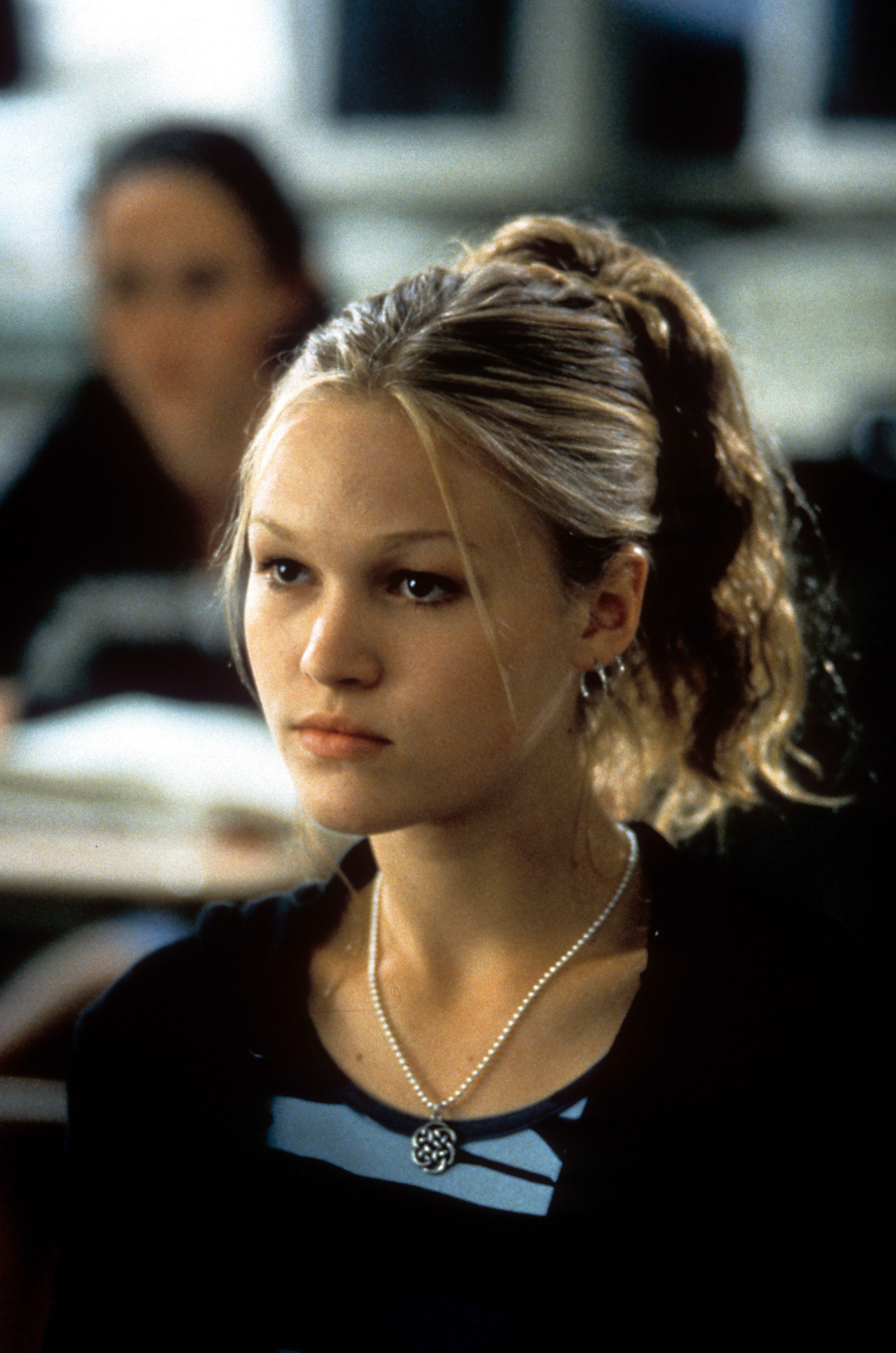 Julia Stiles sitting in a classroom in a scene from the film &quot;10 Things I Hate About You&quot;