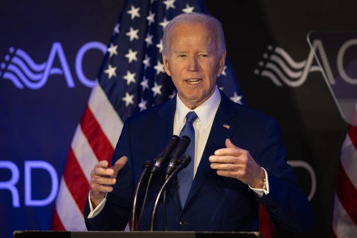 Man successful suit speaks astatine podium with U.S. emblem backdrop