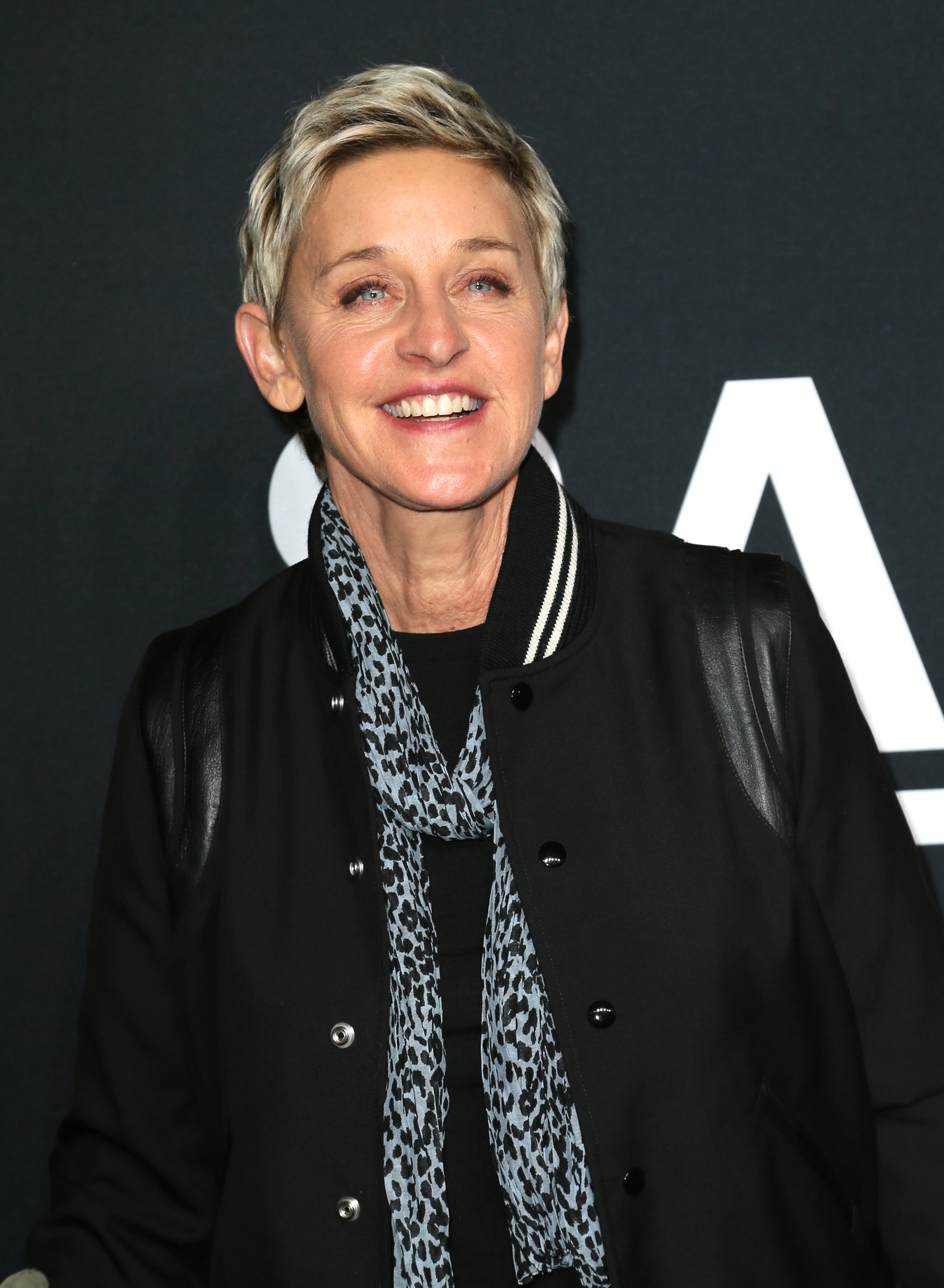 Ellen DeGeneres smiling at an event