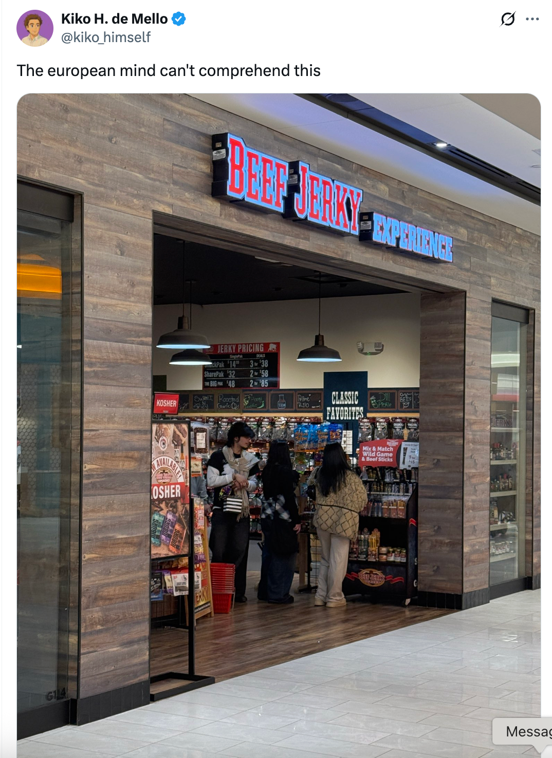 People shopping inside a Beef Jerky store, which has a rustic, wood-paneled design