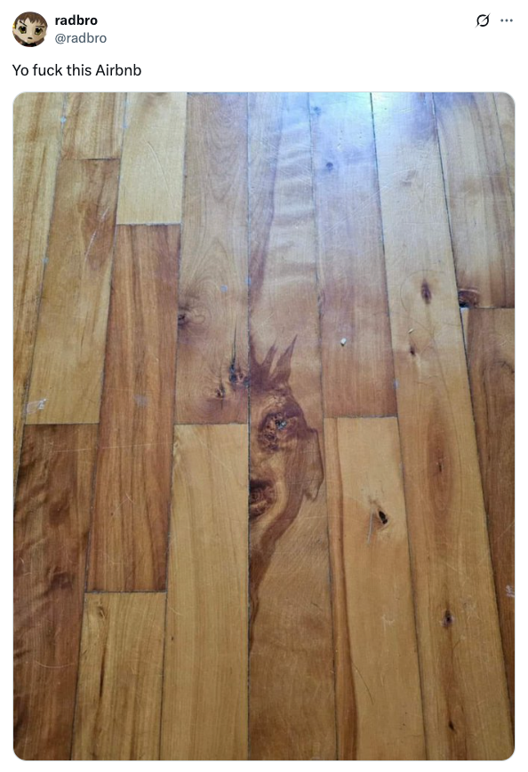 Wooden floor with a unique pattern resembling a face