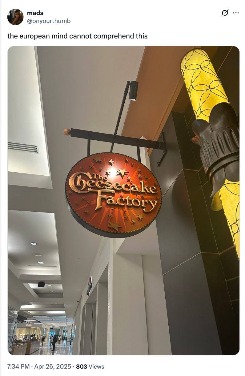 A Cheesecake Factory sign hangs in a mall hallway; tweet above jokes about European confusion