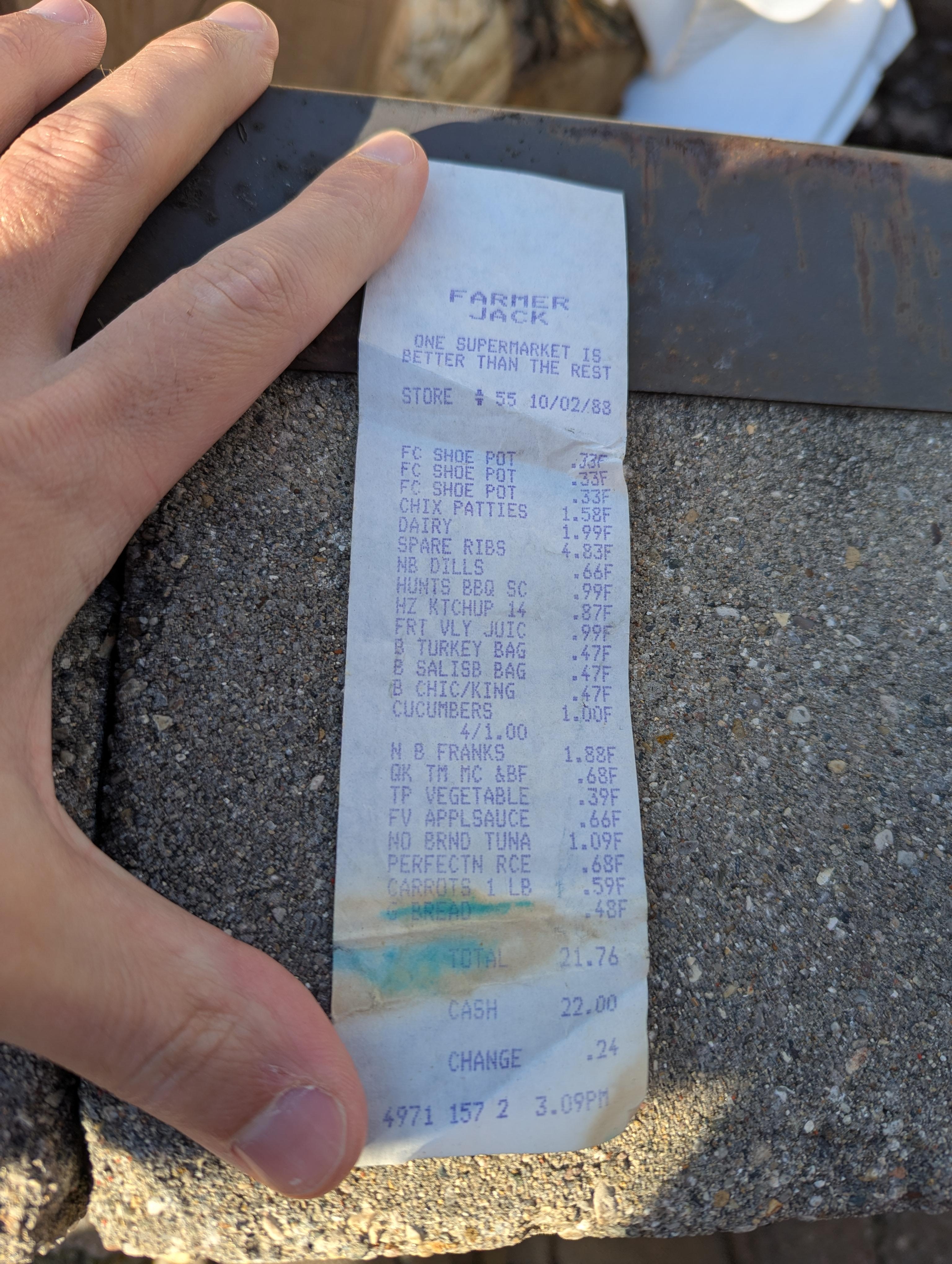 Grocery receipt showing various food items like potatoes and ribs with prices, totaling $22.00. Payment made with $23.00, change given was $1.00