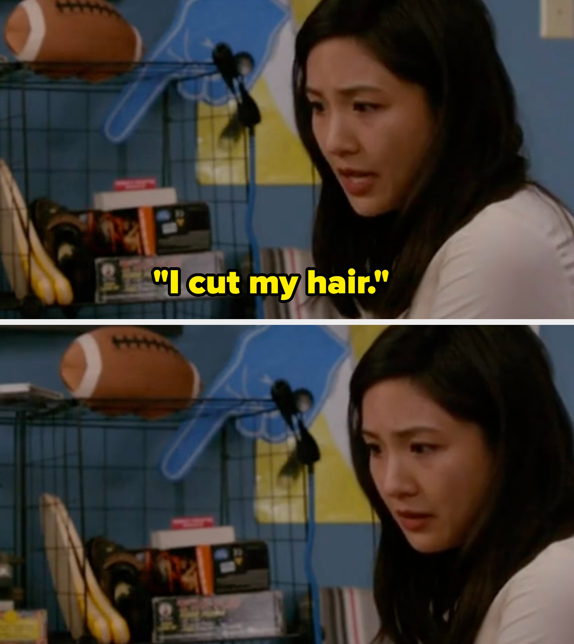 A woman sits pensively in a room filled with sports memorabilia and board games