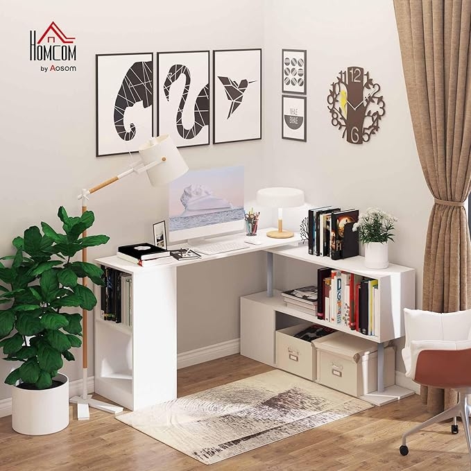 Modern home office setup with a white desk, shelves, wall art, clock, lamp, and potted plant. Clean, organized space ideal for work or study