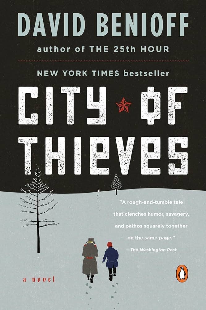 Cover of the book "City of Thieves" by David Benioff, featuring a snowy landscape with two figures. A New York Times bestseller