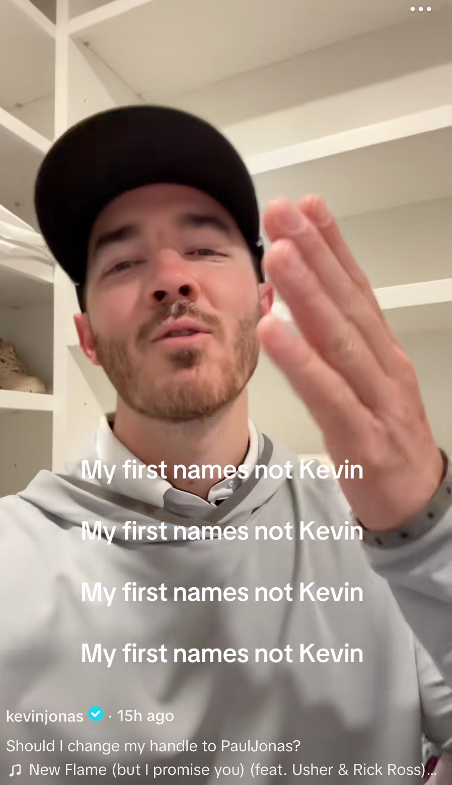 Person in a hoodie gestures humorously on camera. Overlaid text jokes: "My first names not Kevin." Caption below contemplates a social media handle change