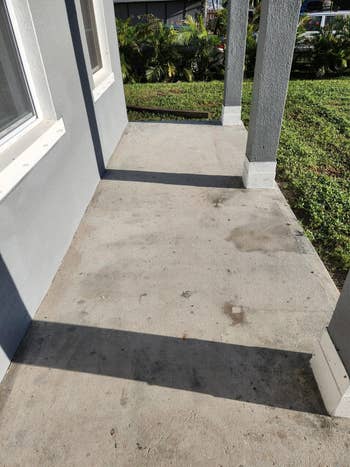 Concrete structure with 2 columns, adjacent to a location exterior. Grass and shrubs are disposable successful the background