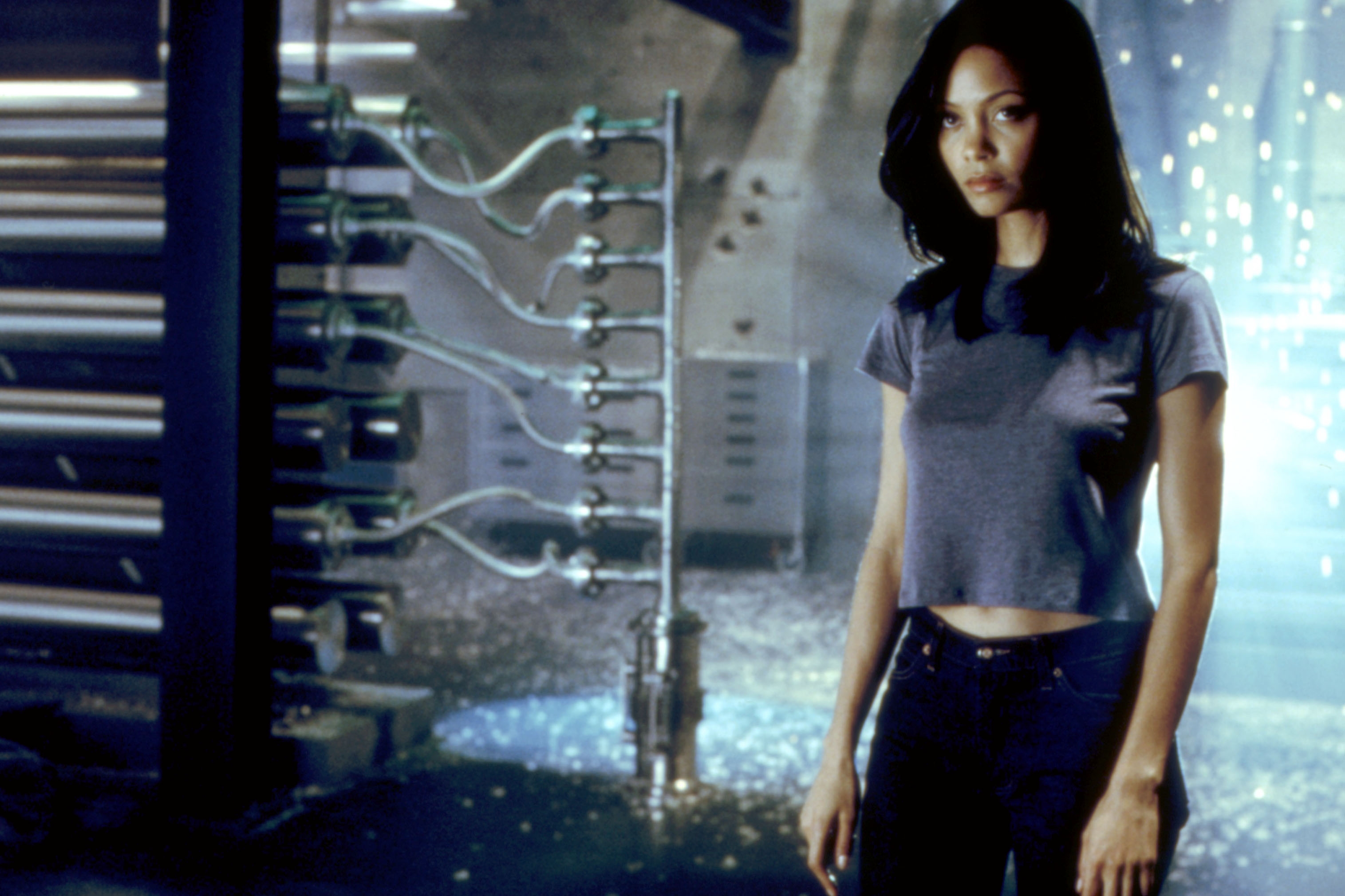 A woman in a casual outfit stands in a futuristic setting, conveying a mysterious, sci-fi atmosphere
