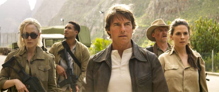 Tom Cruise as Ethan Hunt and the rest of the cast walking intensely in a scene from "Final Reckoning"