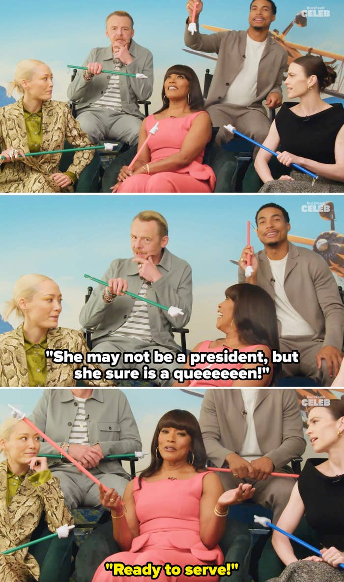 The cast pointing to Angela and Simon saying, "She may not be a president, but she sure is a queen" and Angela saying, "Ready to serve"