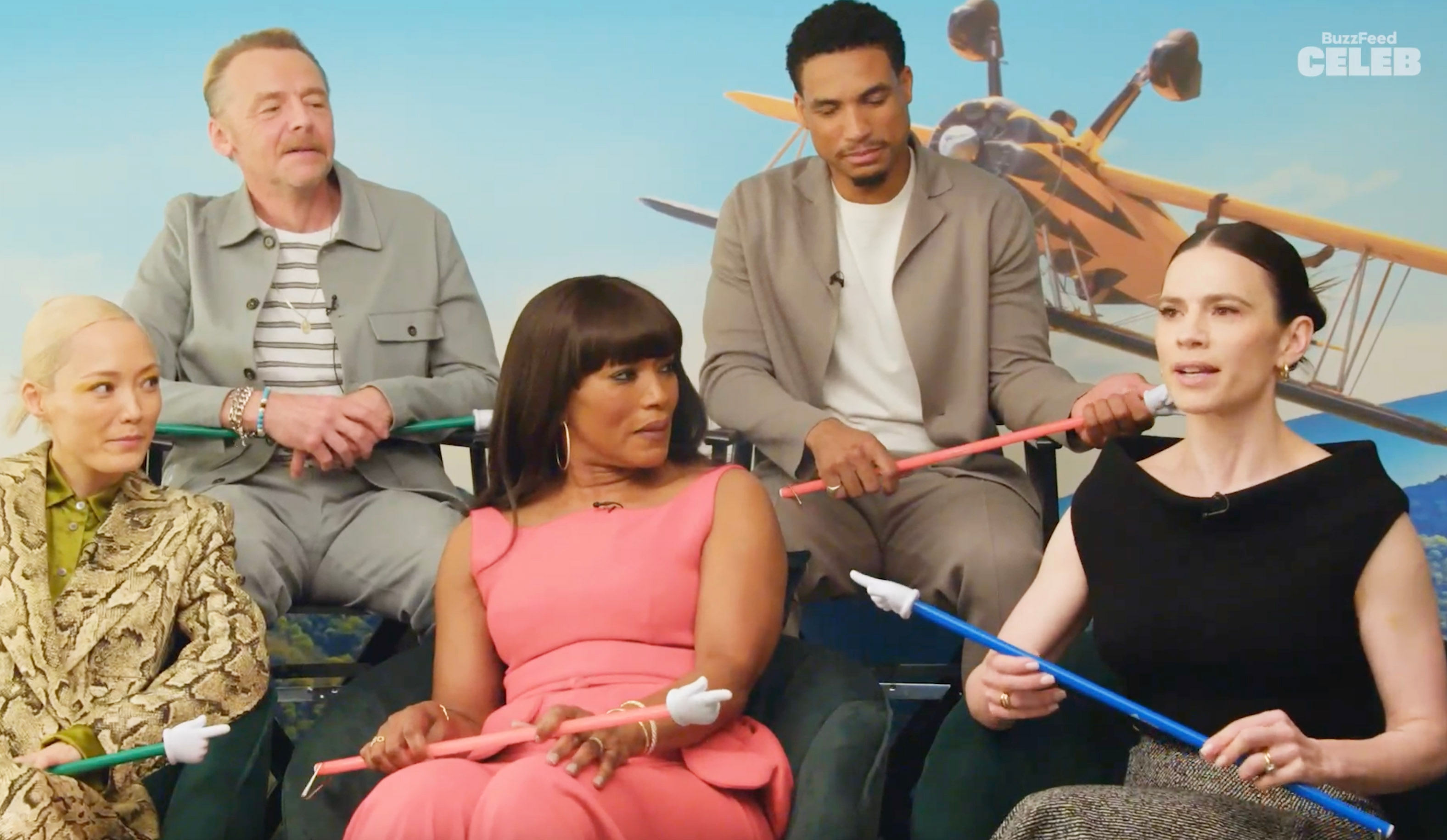 The cast listening to Hayley Atwell talk during an interview"