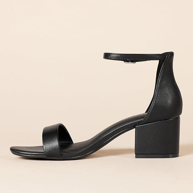 Black heeled sandal with ankle strap and unfastened  toe, displayed connected  a neutral background