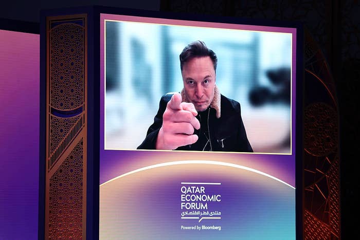 Elon Musk, chief executive officer of Tesla Inc., speaks via video link at the Qatar Economic Forum (QEF) in Doha, Qatar