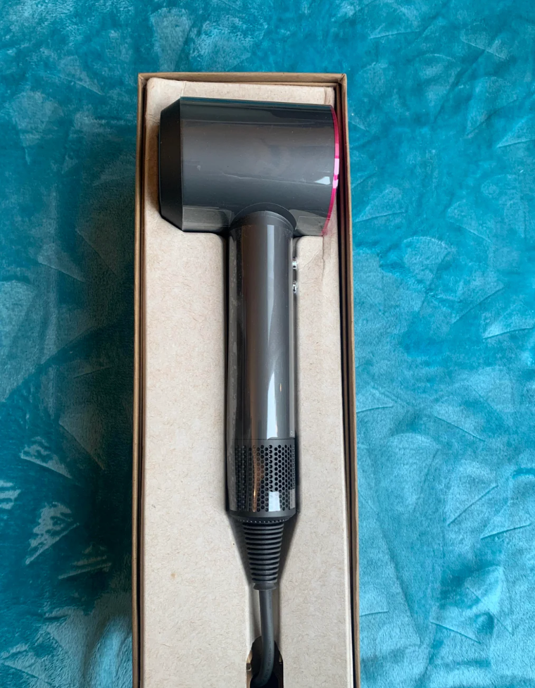 Reddit post review of Dyson Supersonic Hair Dryer, featuring an image of the hair dryer in its packaging