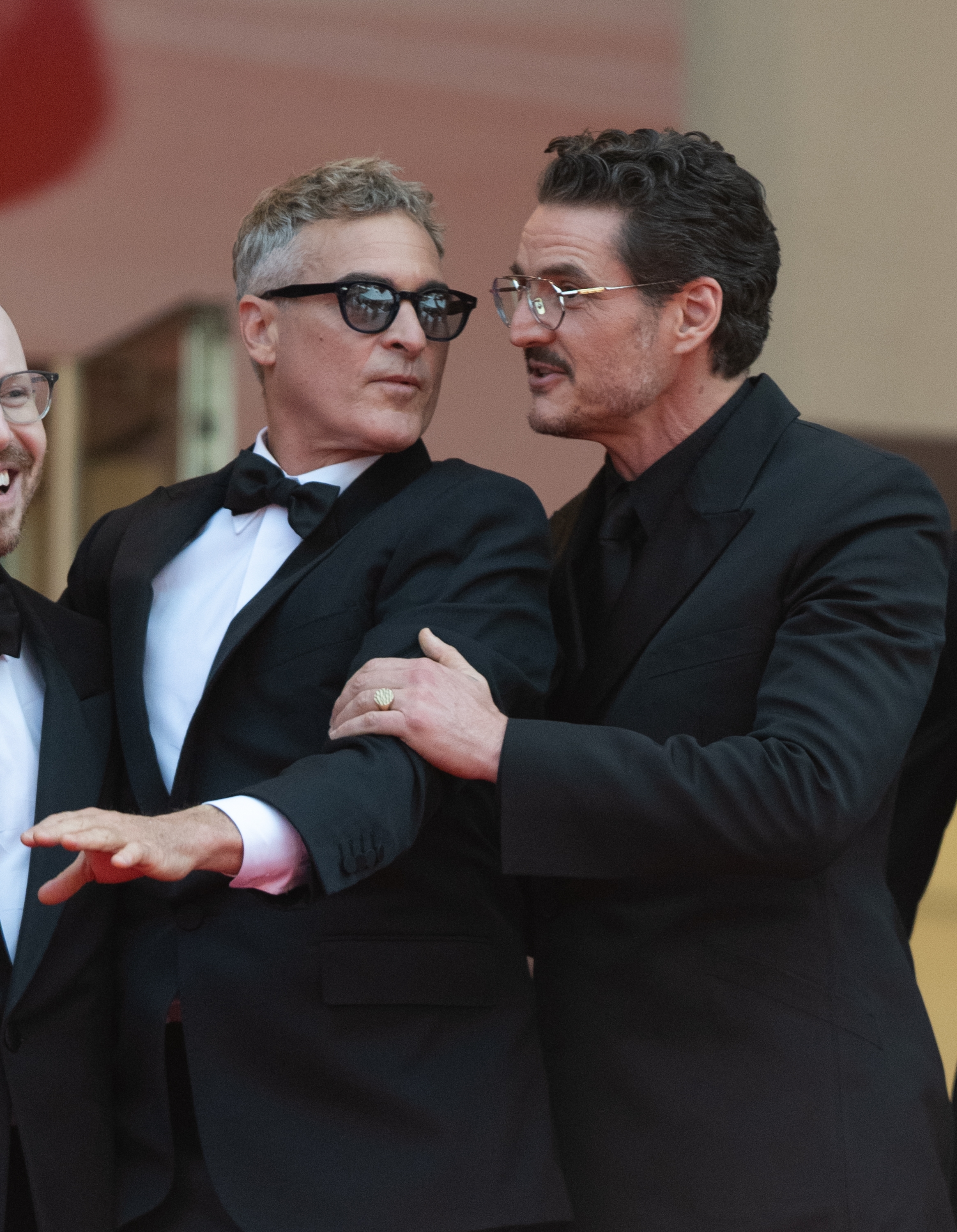 Pedro Pascal stops Joaquin Phoenix from waving at Cannes Film Festival