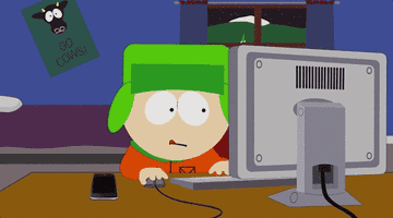 Cartoon character wearing a green hat typing on a computer, with a poster reading "Go Cows!" on the wall behind