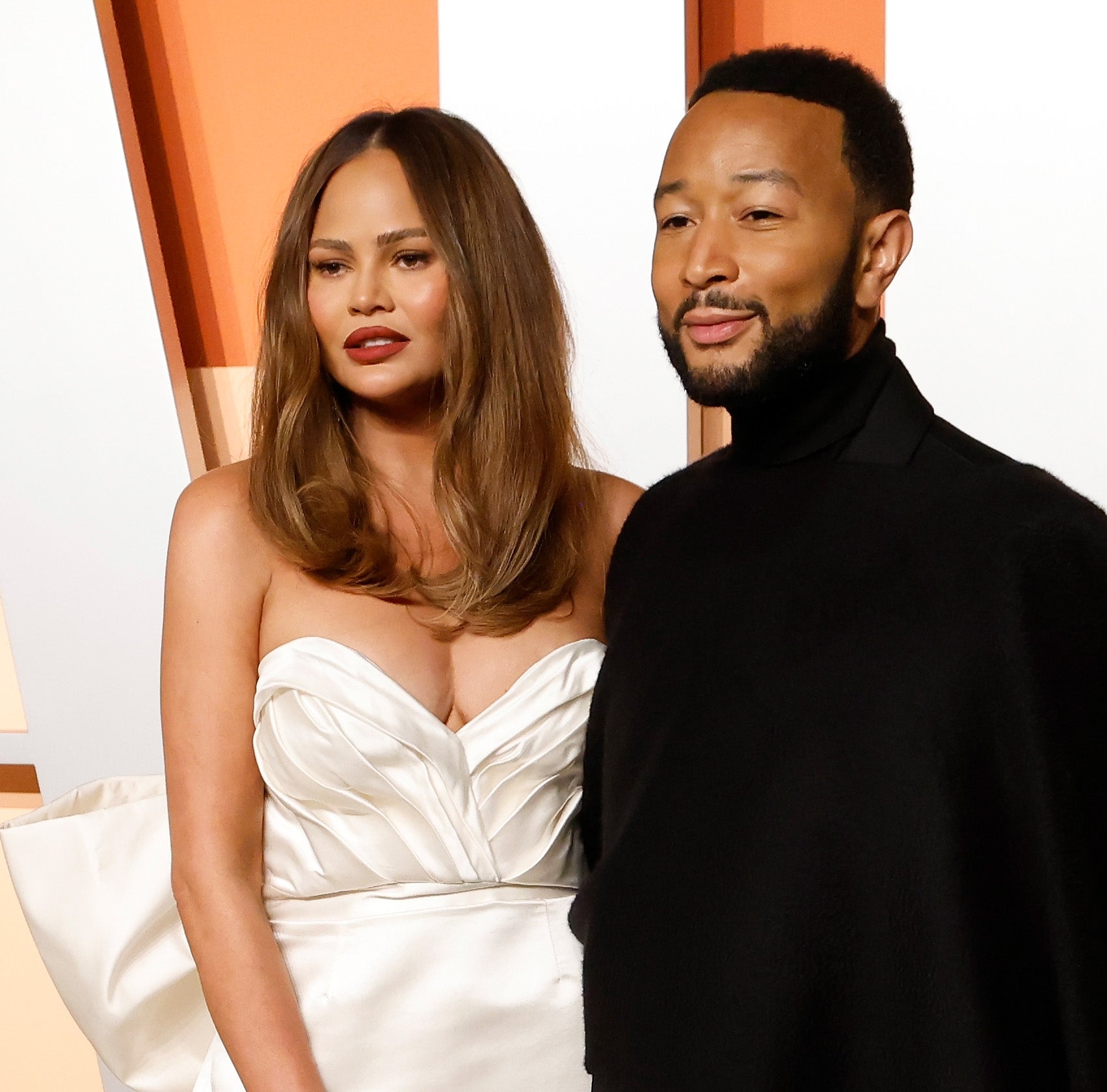 Chrissy Teigen and John Legend at an event