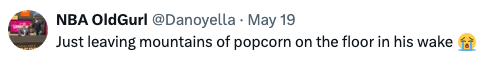 Tweet by @Danoyella: "Just leaving mountains of popcorn on the floor in his wake," with a crying laughing emoji