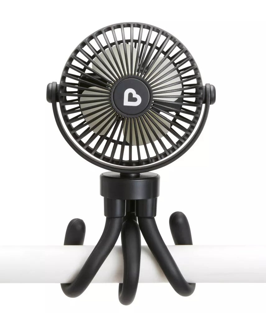 Portable clip-on fan with flexible legs attached to a pole for versatile placement options