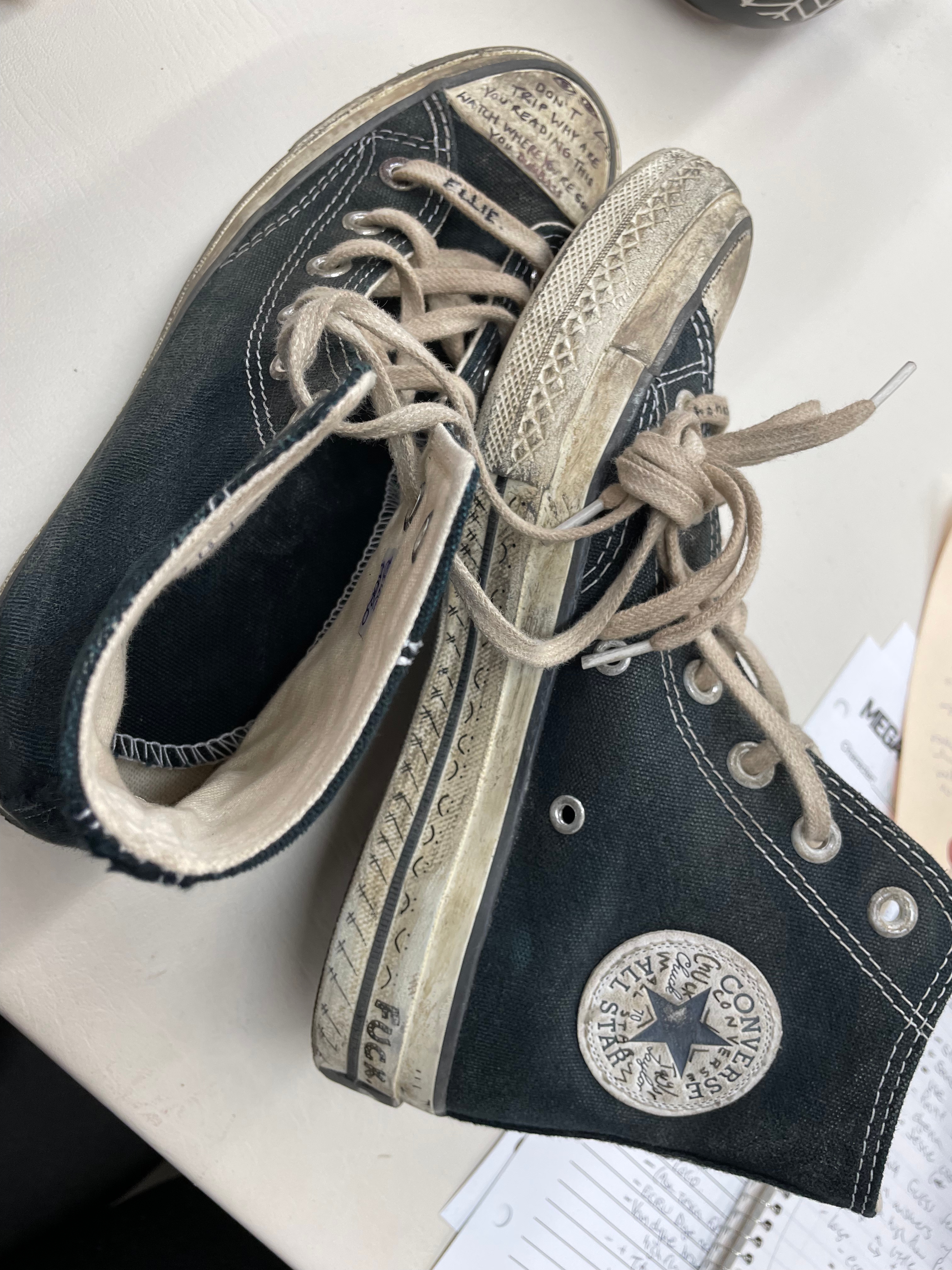 A close-up of Ellie's Converse with doodles by Bella Ramsey