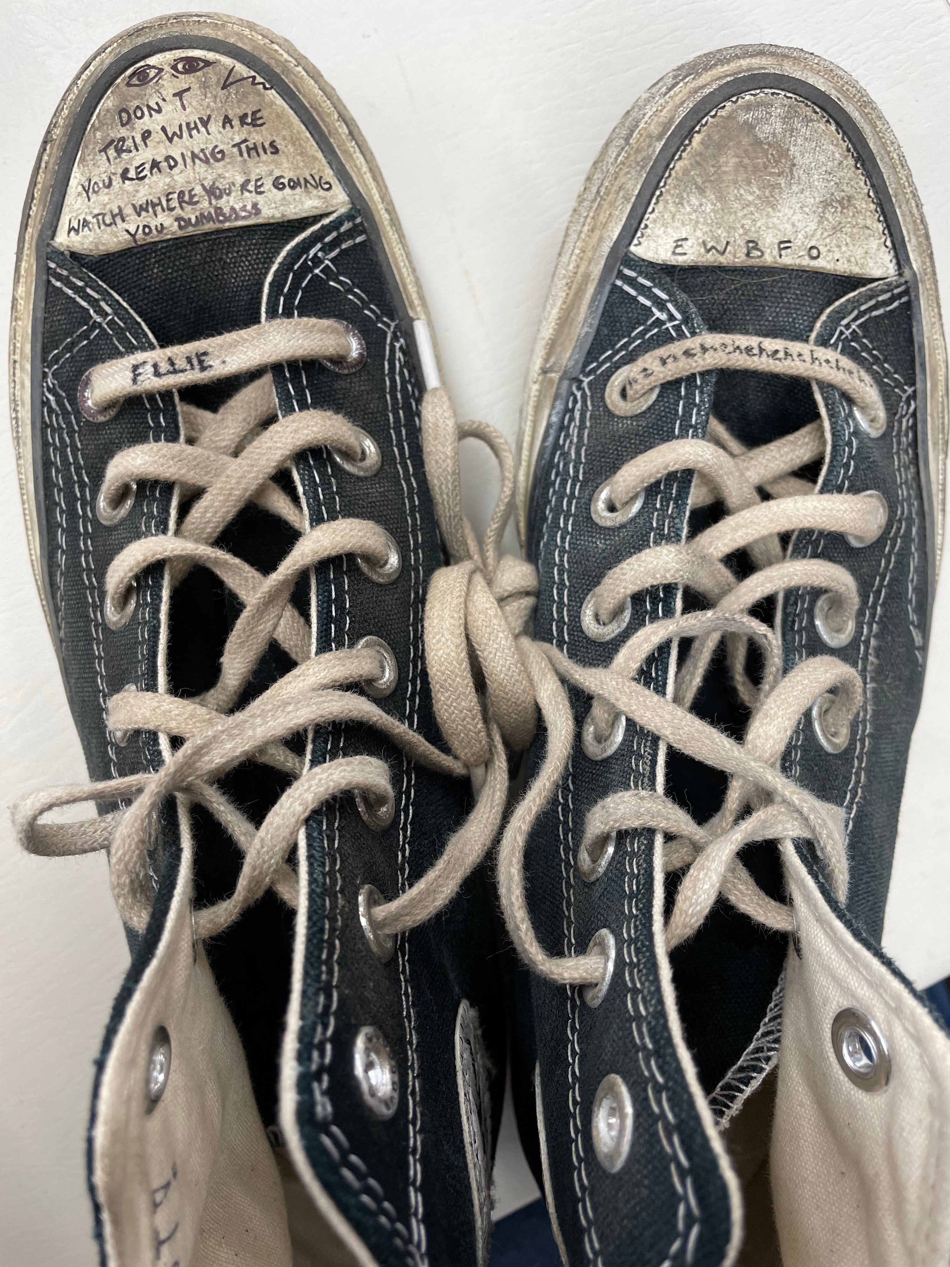 A close-up of Ellie's Converse with doodles by Bella Ramsey
